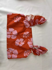 Orange floral print ruffled crop top and maxi skirt set made of polyester.