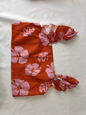 Orange floral print ruffled crop top and maxi skirt set made of polyester.
