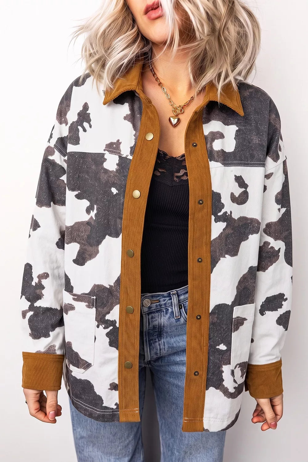 dark gray denim jacket featuring buttoned and cow-print