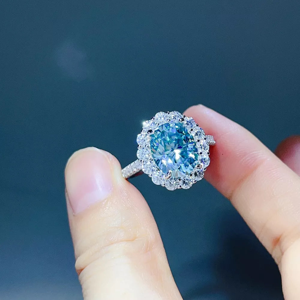 ring in light blue featuring halo setting and oval fit