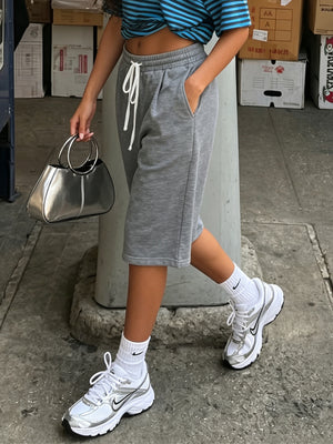 100% polyester Care instructions: Machine wash cold bermuda shorts in heather grey with relaxed silhouette