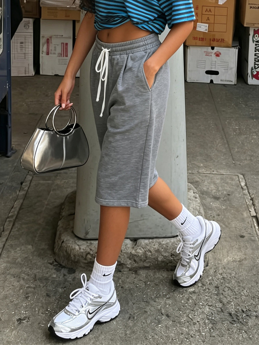 100% polyester Care instructions: Machine wash cold bermuda shorts in heather grey with relaxed silhouette