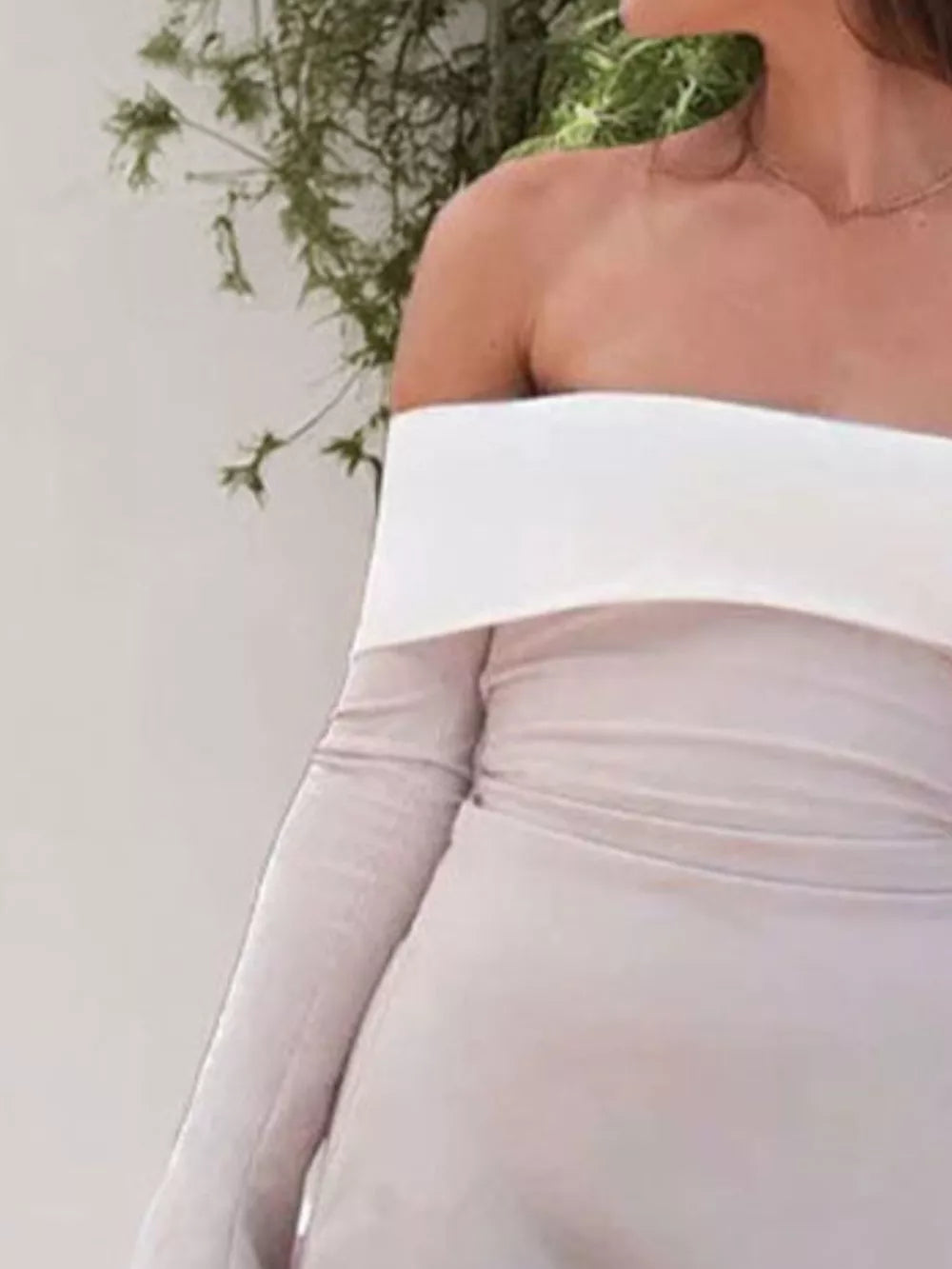Eggshell off-shoulder dress with flare sleeves and a-line skirt.