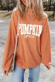 Textured corduroy sweatshirt in sherbet with "Pumpkin Spice" graphic.