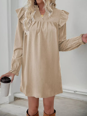 Apricot ruffled notched sleeve dress with cinched cuffs and a V-neckline.