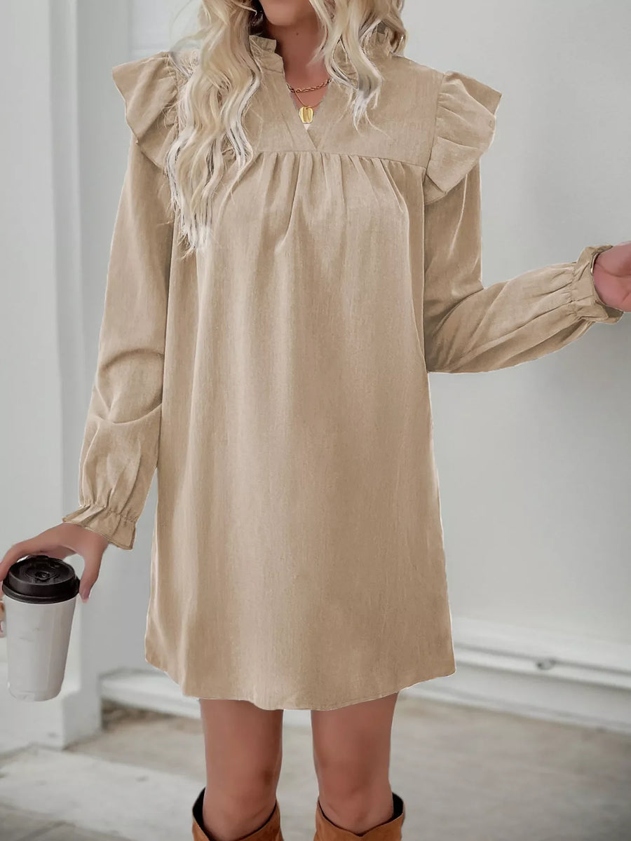 Apricot ruffled notched sleeve dress with cinched cuffs and a V-neckline.