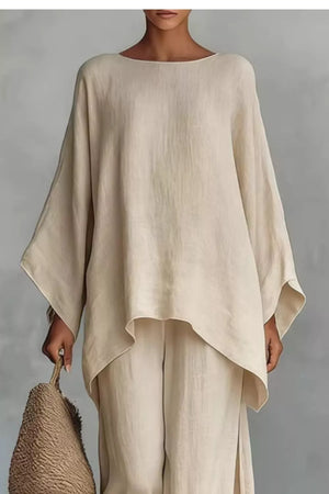 Beige polyester two-piece set with flowing top and wide-leg pants.