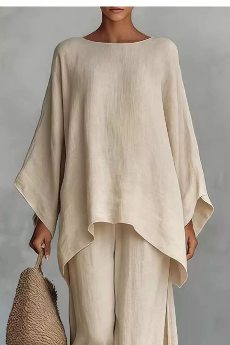 Beige polyester two-piece set with flowing top and wide-leg pants.