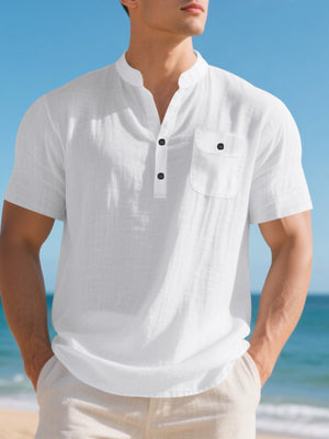 White cotton band-collar short-sleeve shirt with button-down placket and chest pocket.