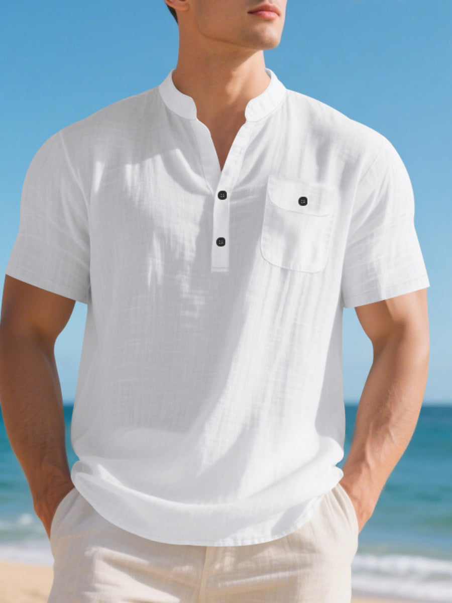 White cotton band-collar short-sleeve shirt with button-down placket and chest pocket.