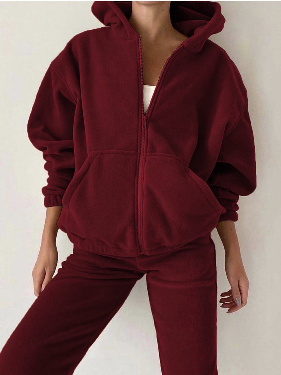 Burgundy fleece zip-up hoodie with pockets and matching joggers.