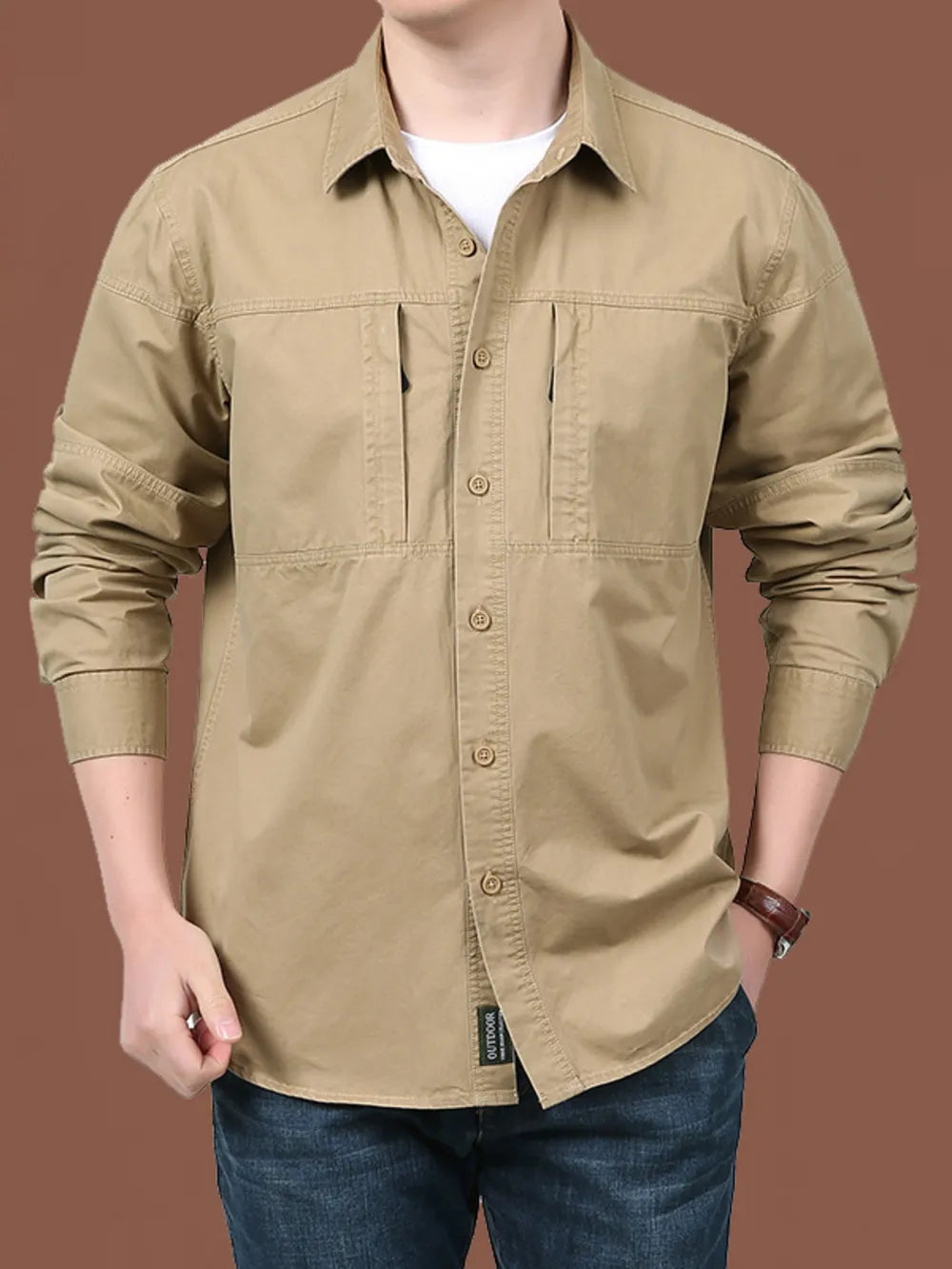 Khaki cotton button-front shirt with chest pockets and relaxed fit.