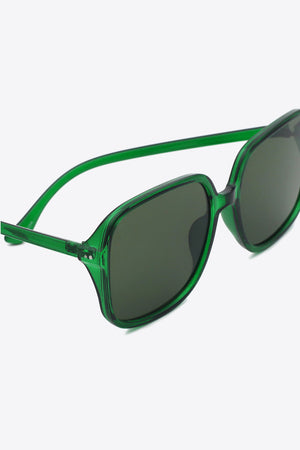 Green retro square frame sunglasses with dark lenses and bold acetate frames.