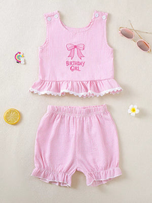 Pink striped cotton baby tank and shorts set with "Birthday Girl" embroidery and ruffled trim.