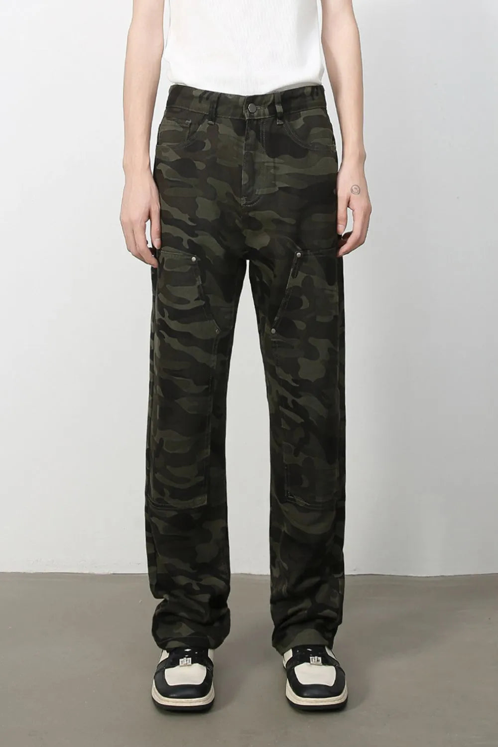 Utility camo carpenter jeans in black with multiple cargo pockets.