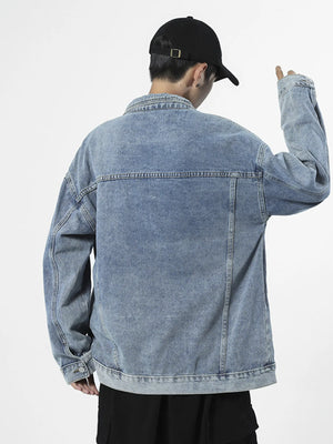 Light blue denim trucker jacket with button-up front and classic fit.