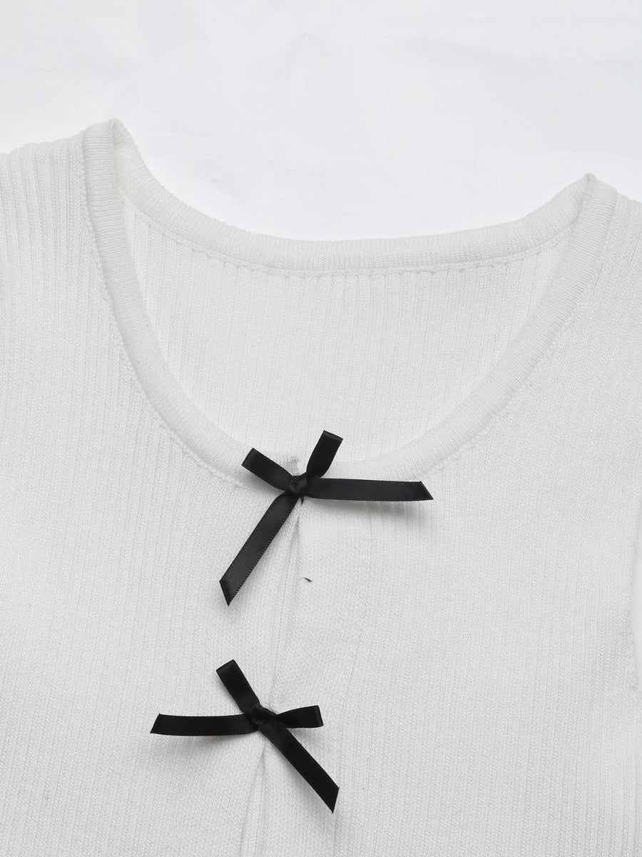 White ribbed knit tank top with black bow details at the neckline