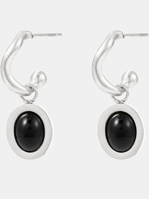 Sculptural hoop earrings with steel setting and black agate inset.