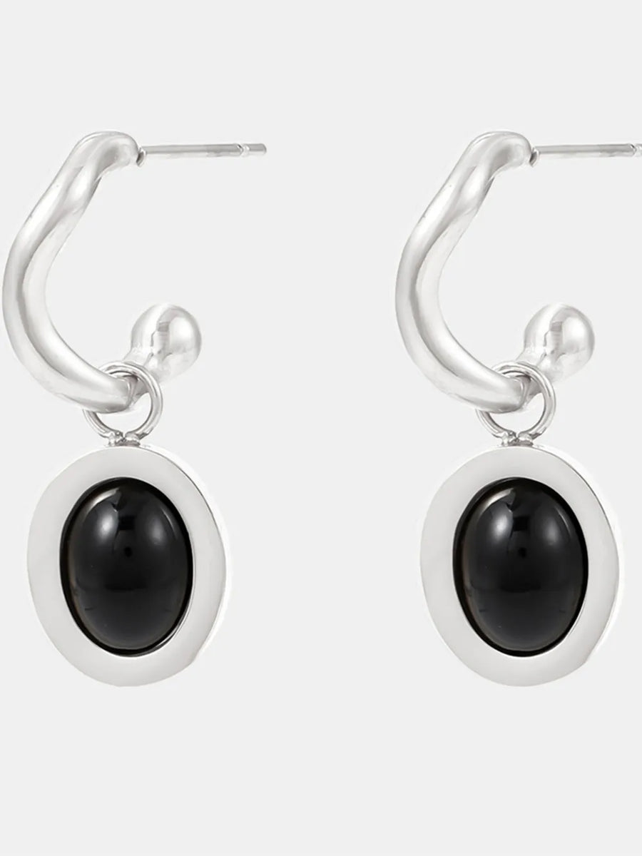 Sculptural hoop earrings with steel setting and black agate inset.