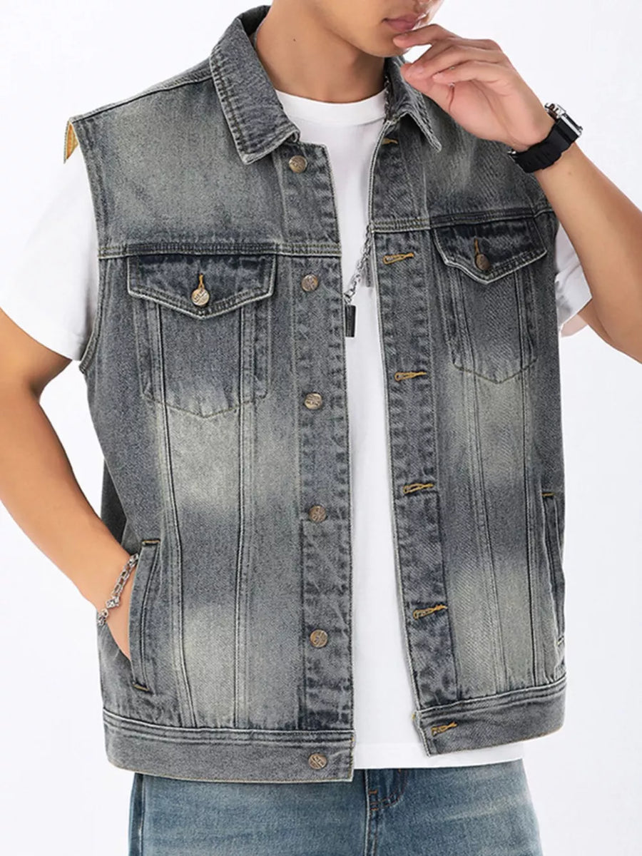 Men's gray denim vest with button front, chest pockets, and collar