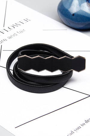 Black elastic belt with a geometric buckle detail