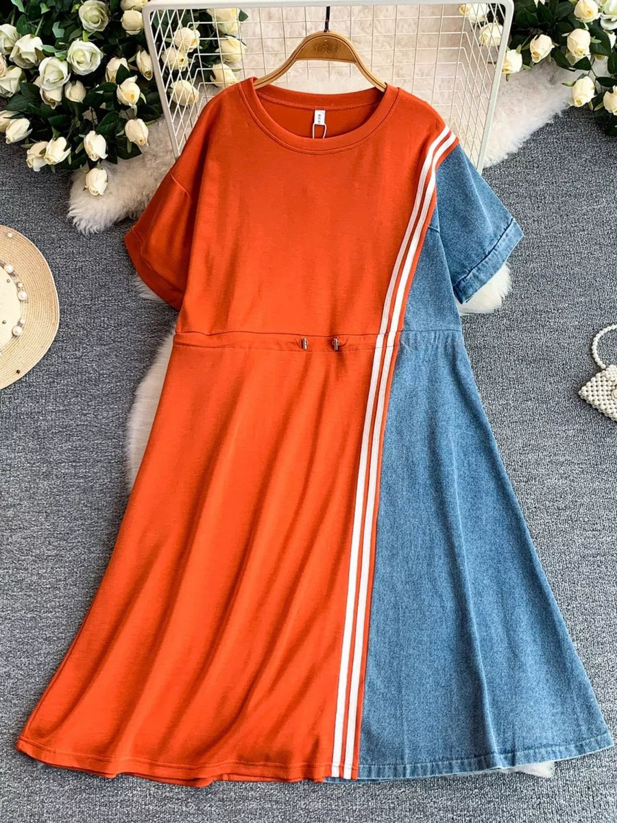 Orange red and denim color block casual dress with drawstring waist and white stripes.
