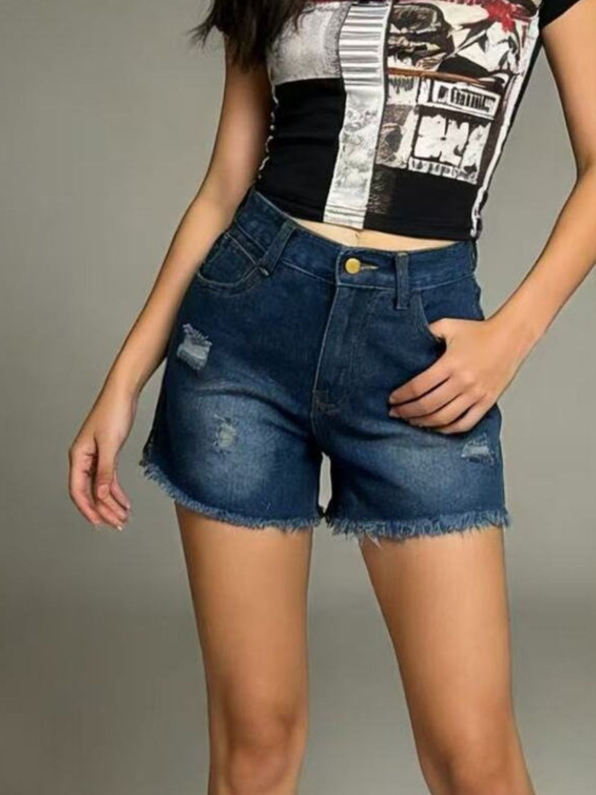 Dark blue distressed denim shorts with frayed hem and high waist.