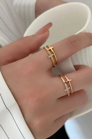 Double band ring with cross embellishment in gold and rose gold