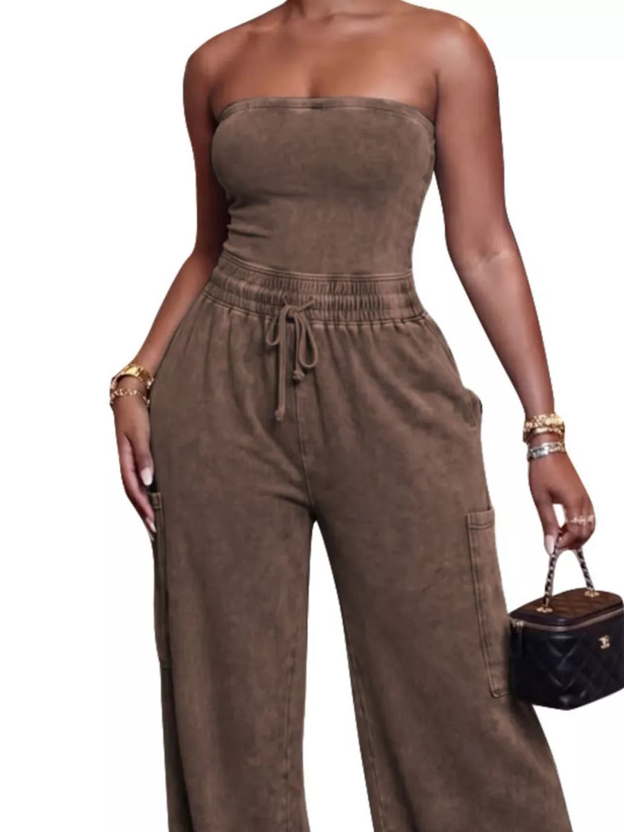 Brown washed cotton strapless jumpsuit with drawstring waist and cargo pockets.