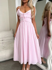 Pink ruffled midi dress with spaghetti straps and tie-front detail