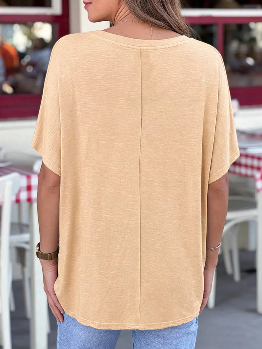 Apricot relaxed fit V-neck tee, 100% polyester, short sleeves, basic casual style.