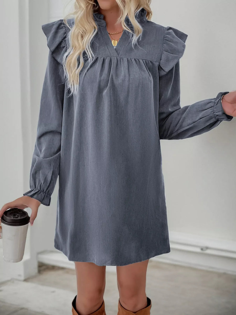 Dark gray cotton blend dress with ruffled notched sleeves and cinched cuffs.