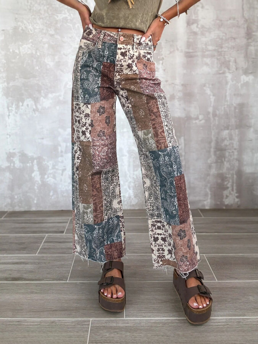 brown flare pants featuring raw hem and patchwork