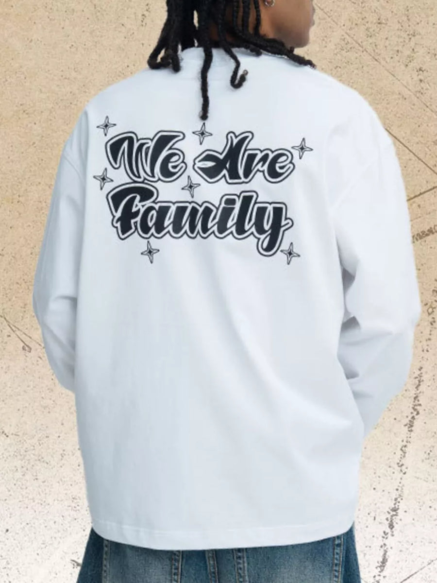 White long sleeve tee with black "We Are Family" graphic print and star accents