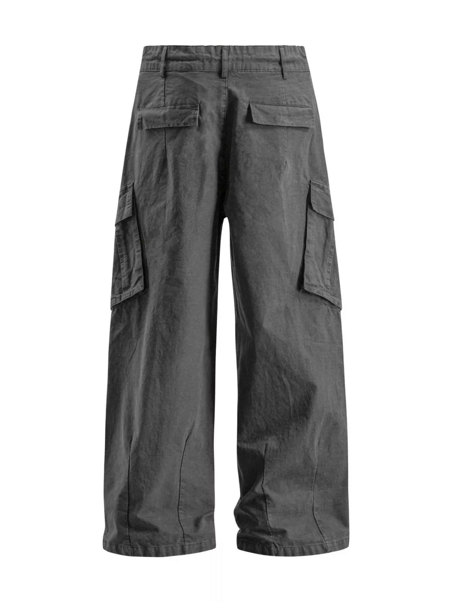 Grey wide leg cargo pants with multiple pockets and a relaxed fit.