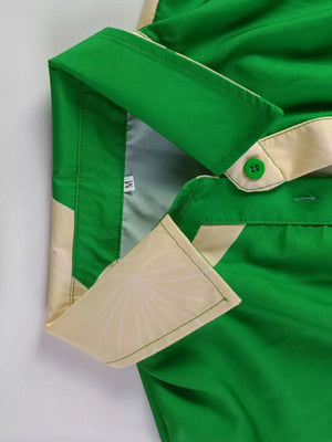 Green abstract print belted shirt dress with collared neckline and button details.