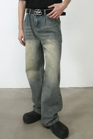 Faded wash baggy carpenter jeans in medium with a relaxed fit and distressed details.