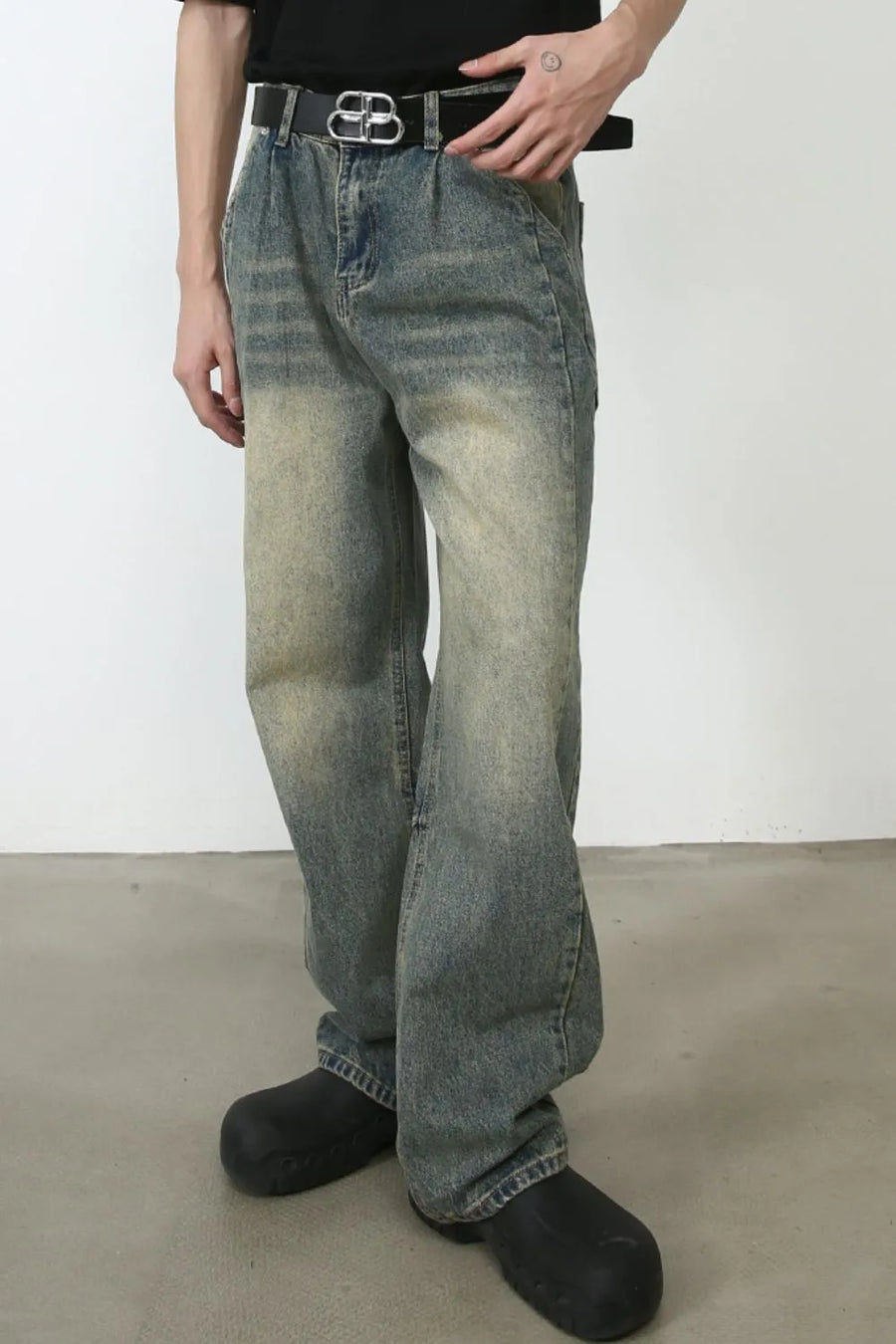Faded wash baggy carpenter jeans in medium with a relaxed fit and distressed details.