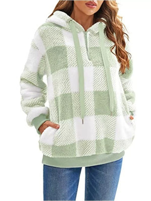 Green and white plaid sherpa hoodie with drawstring and front pocket.