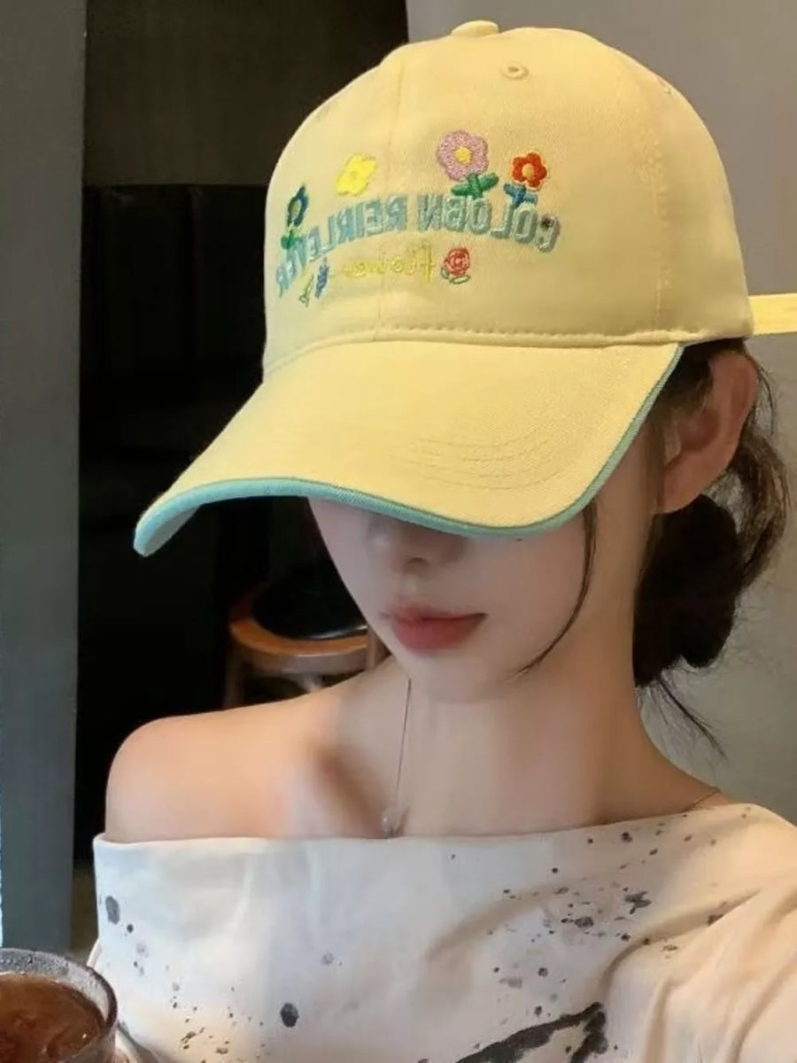 Yellow cotton baseball hat with floral embroidery and light blue trim