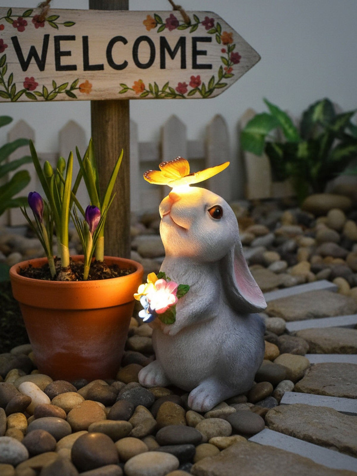 Easter bunny garden ornament with solar butterfly and flowers, light-up detail