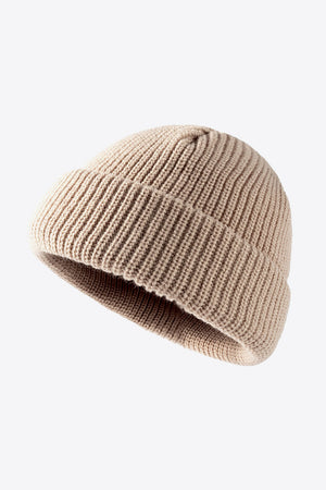 Beige ribbed knit beanie with folded edge detail