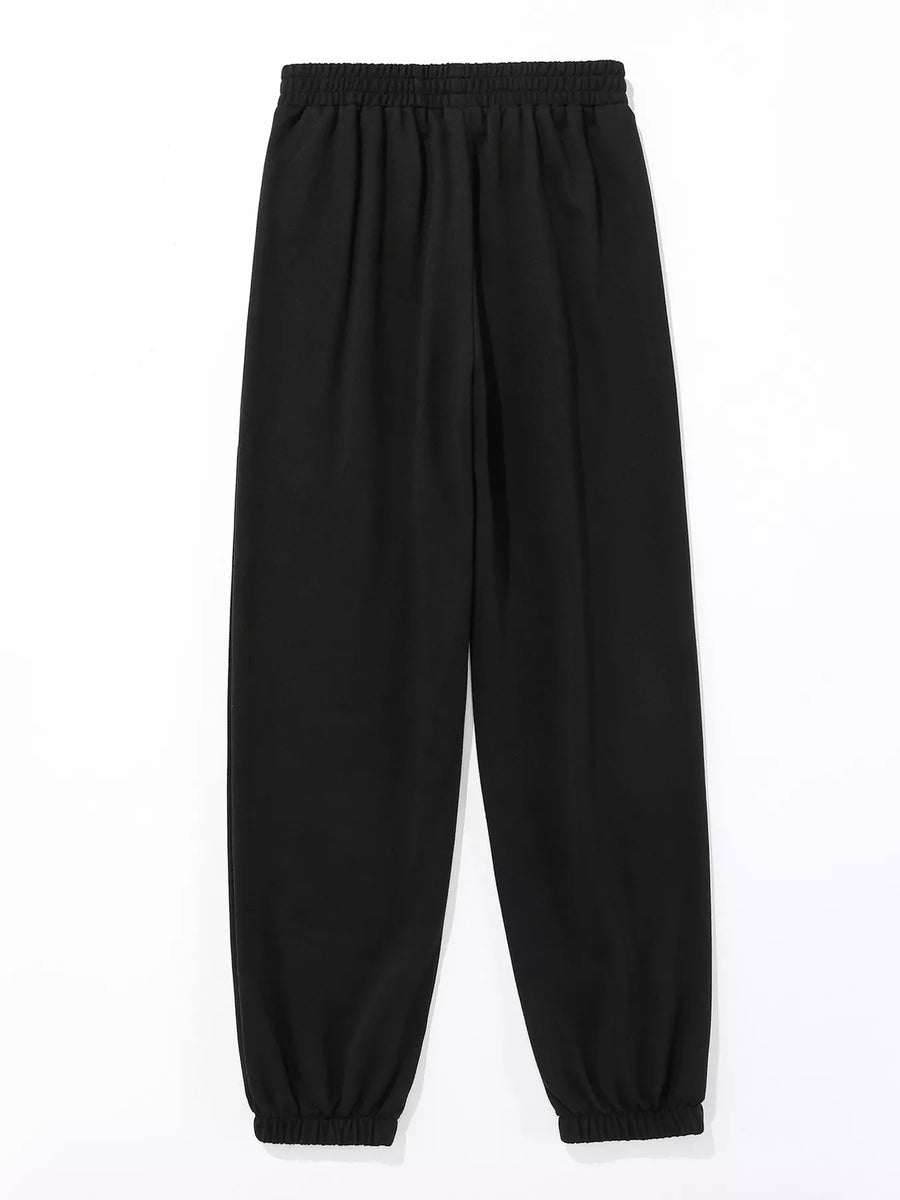 Black sweatpants with elastic waistband and cuffs, featuring subtle butterfly embellishments.