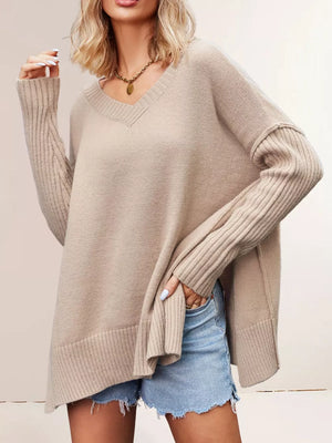 v-neck sweater in light beige featuring ribbed sleeves and relaxed fit