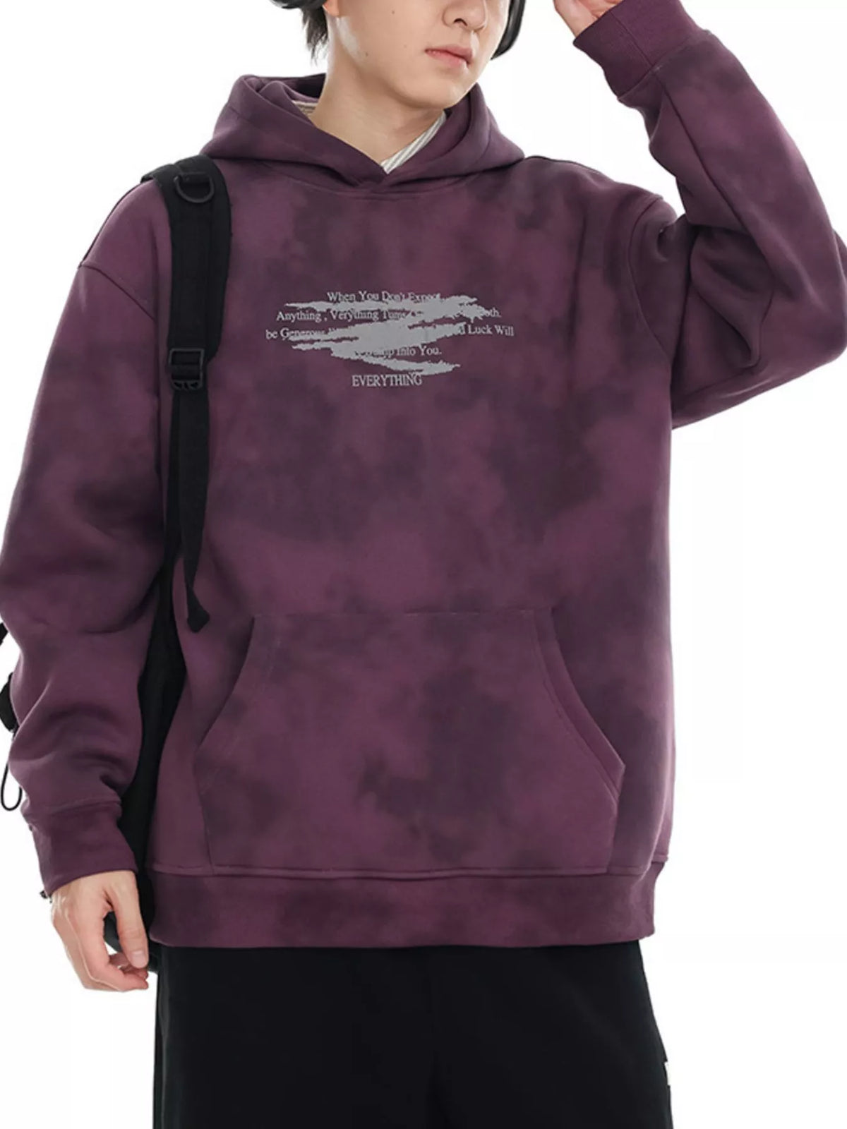 Oversized tie-dye hoodie in Berry Purple with graphic print and front pocket.