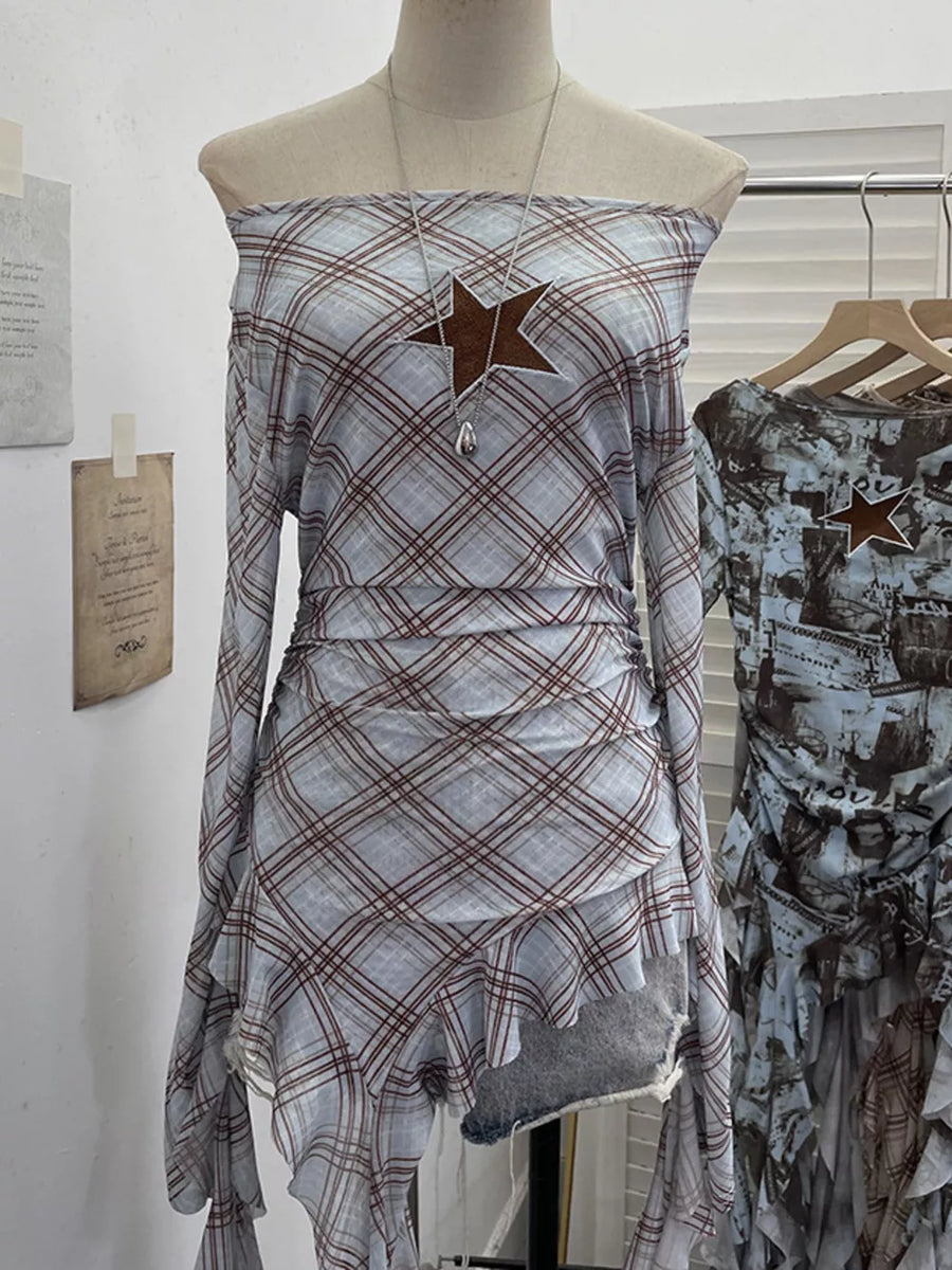 Asymmetrical ruffle hem maternity overshirt in blue plaid with a star detail and ruched sides.