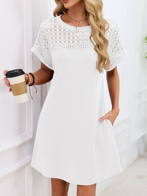 White t-shirt dress with sheer lace yoke and short sleeves, above knee length