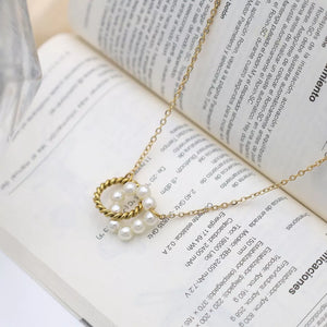 necklace in gold featuring twisted pendant and regular fit