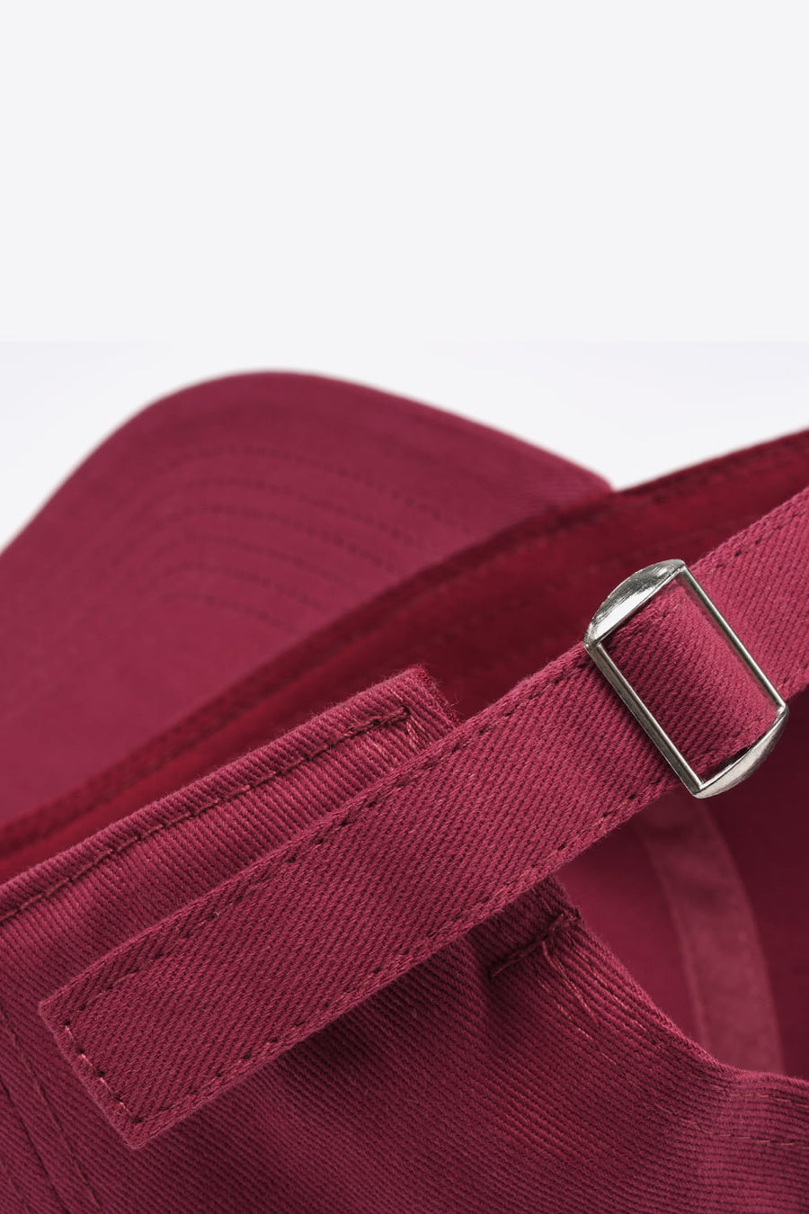 Deep Red baseball cap with adjustable strap and metal buckle detail