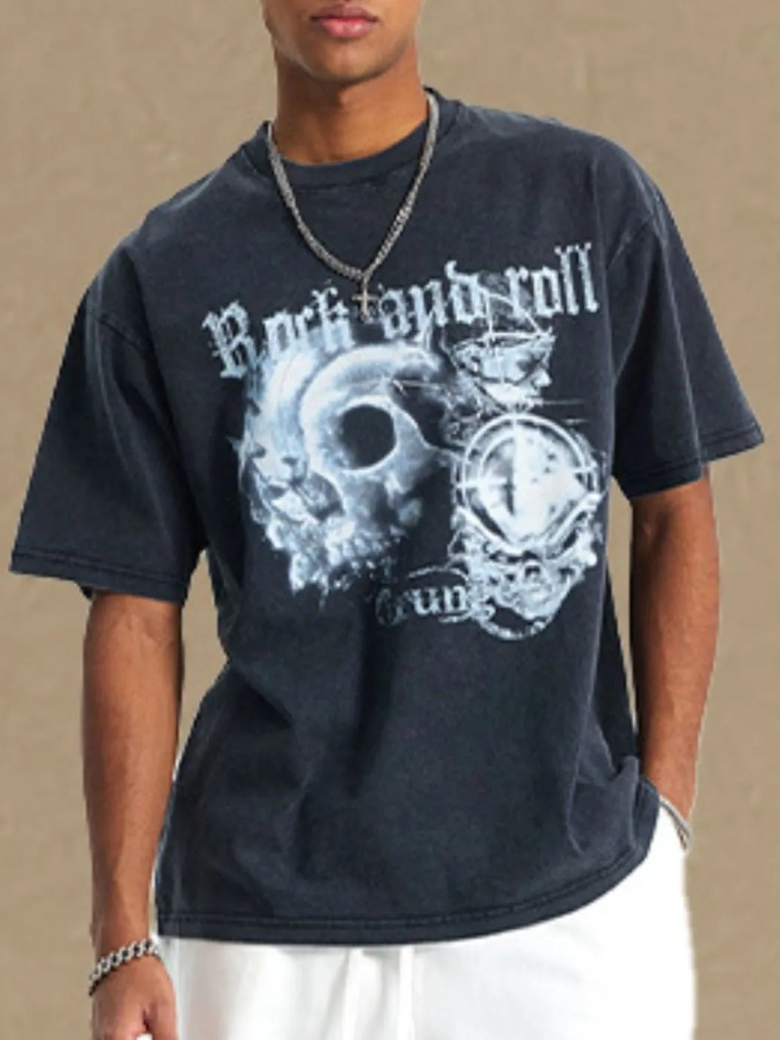 Black vintage rock graphic t-shirt with skull and gothic font.